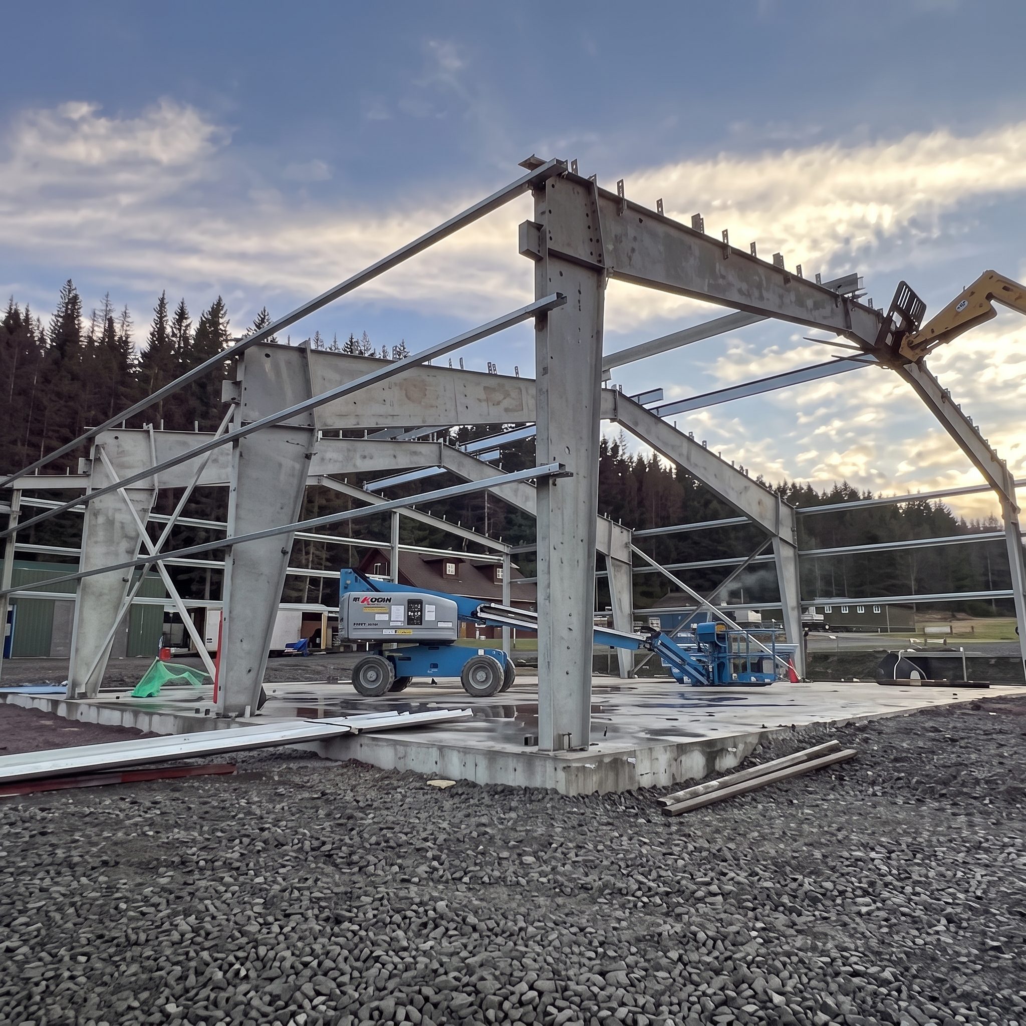 Steel building frame erected on a rural job site